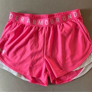 Under Armour pink workout shorts.